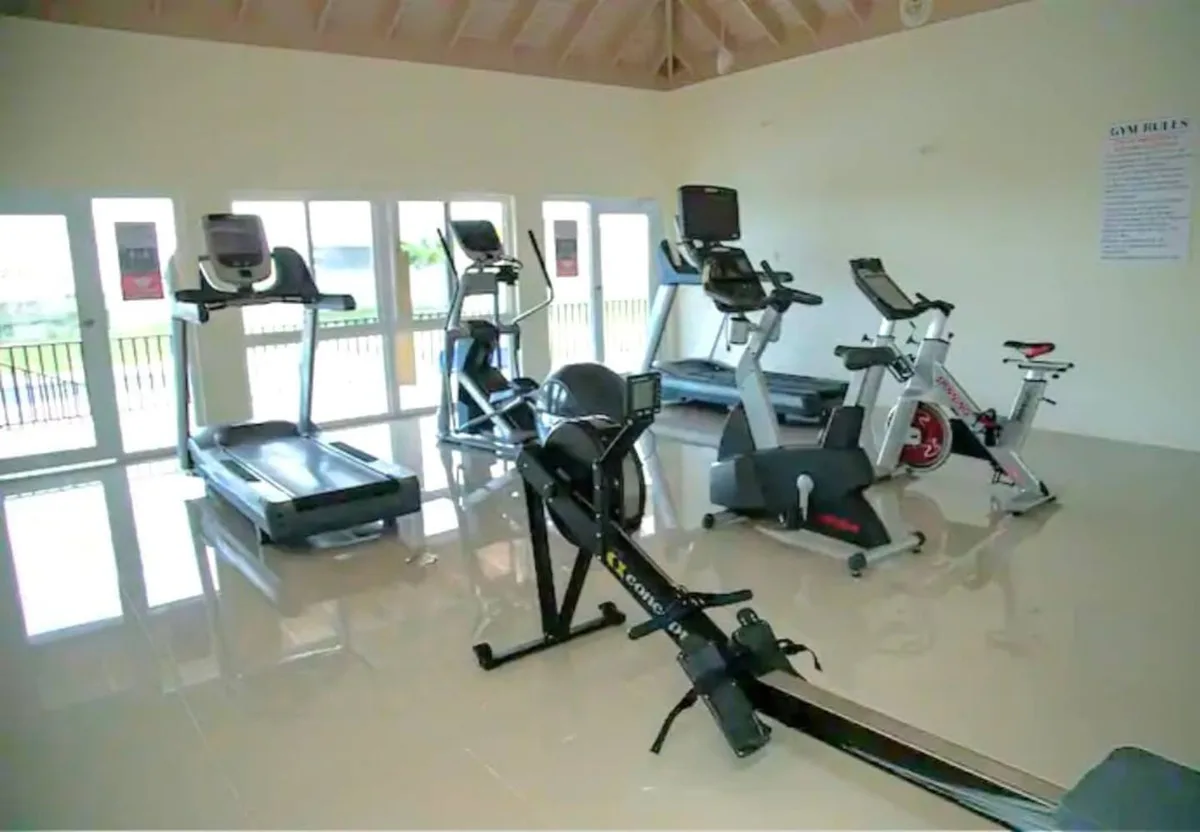 Community fitness center with treadmills, bikes, and rowing machine